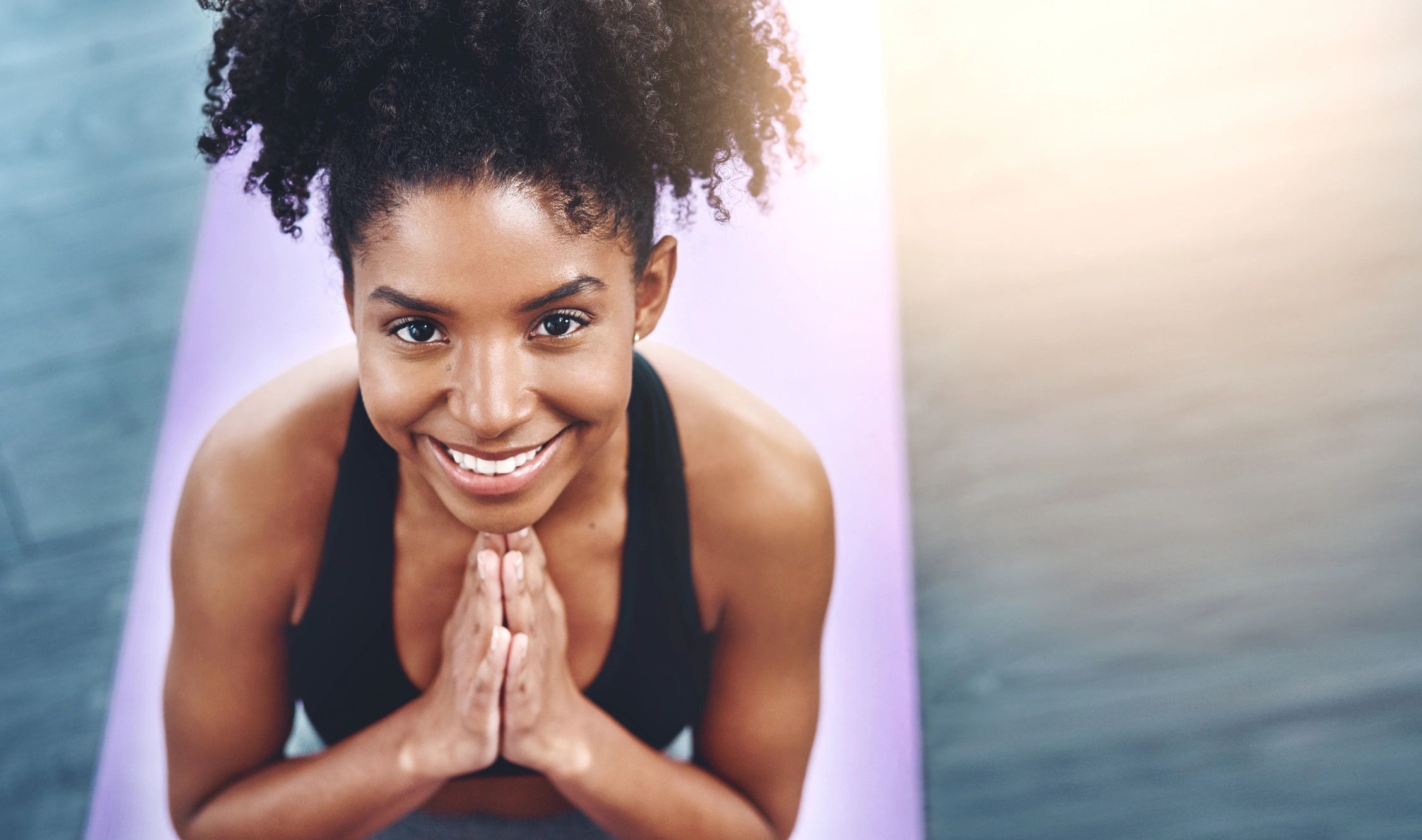Young woman practicing yoga in a studio