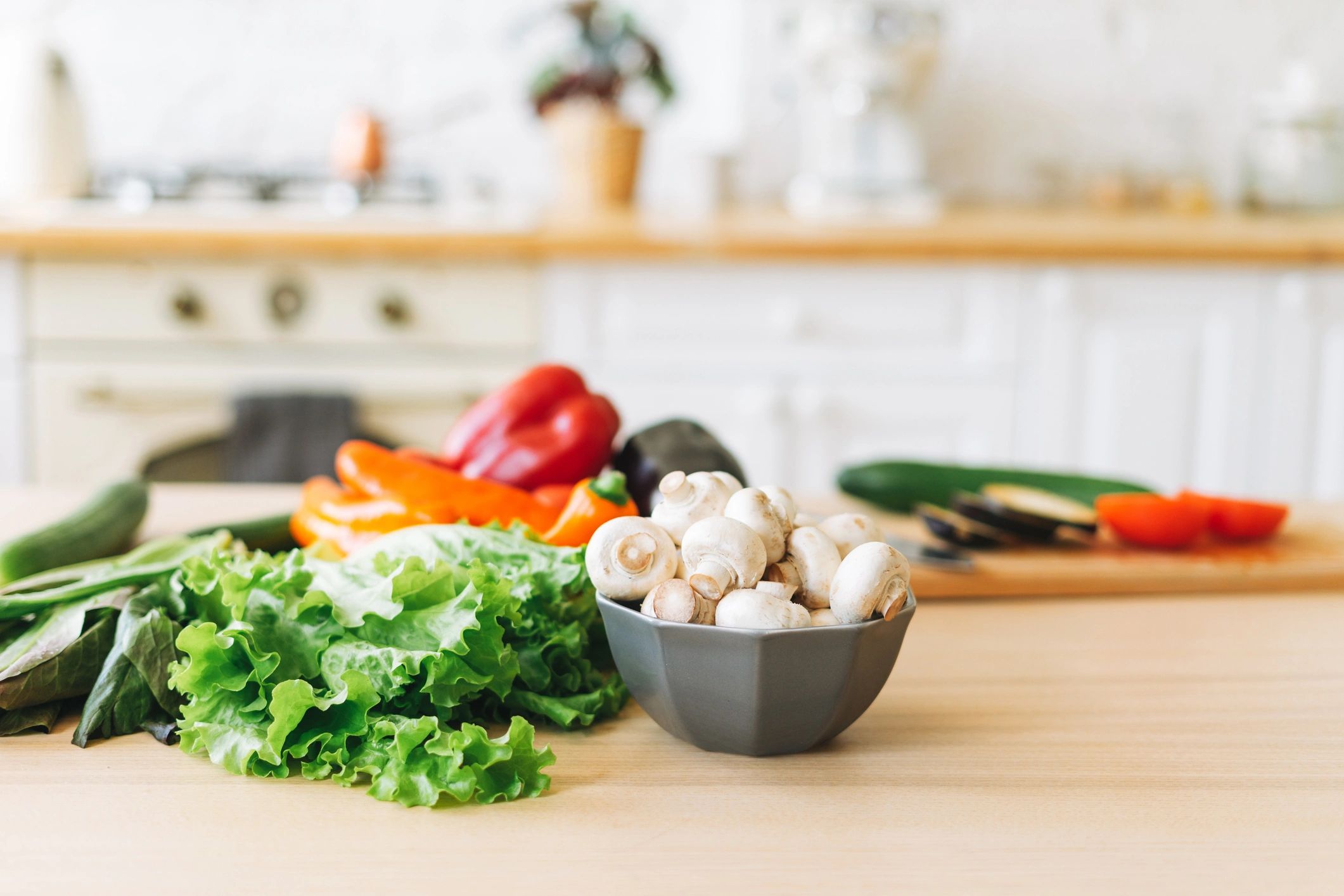 Fresh vegetables on a kitchen table during meal preparation