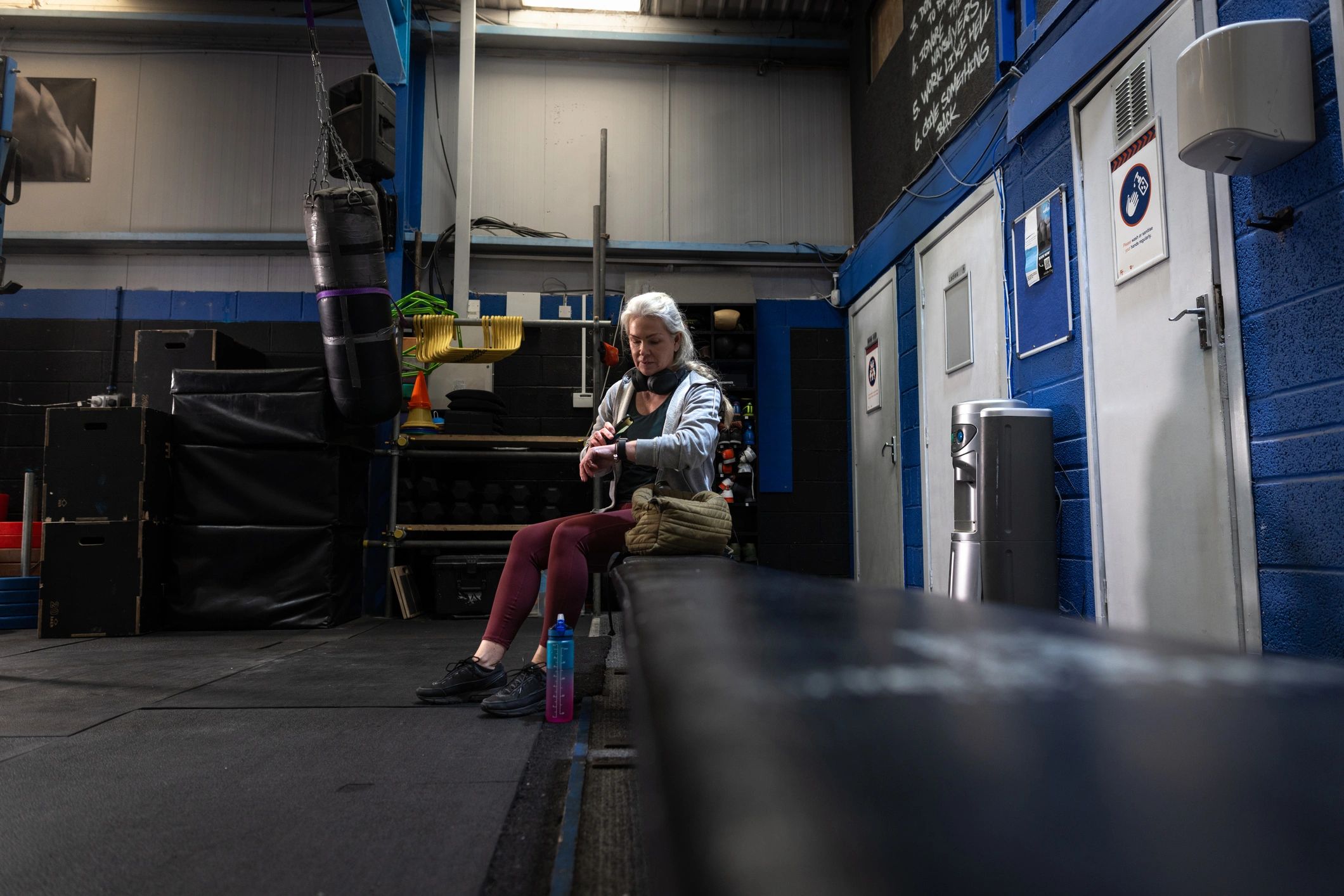 Woman checking a smart watch before training in a gym