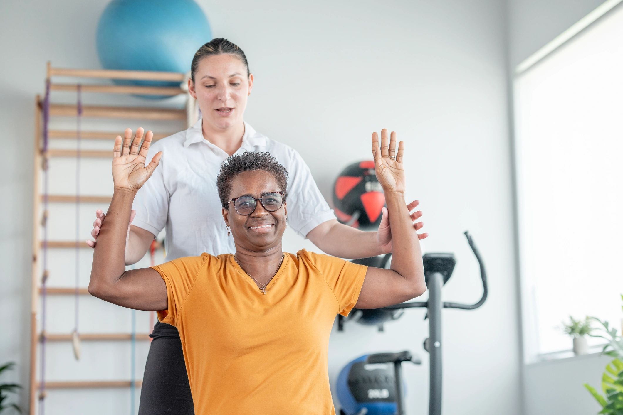 Supportive coaching session in a bright gym