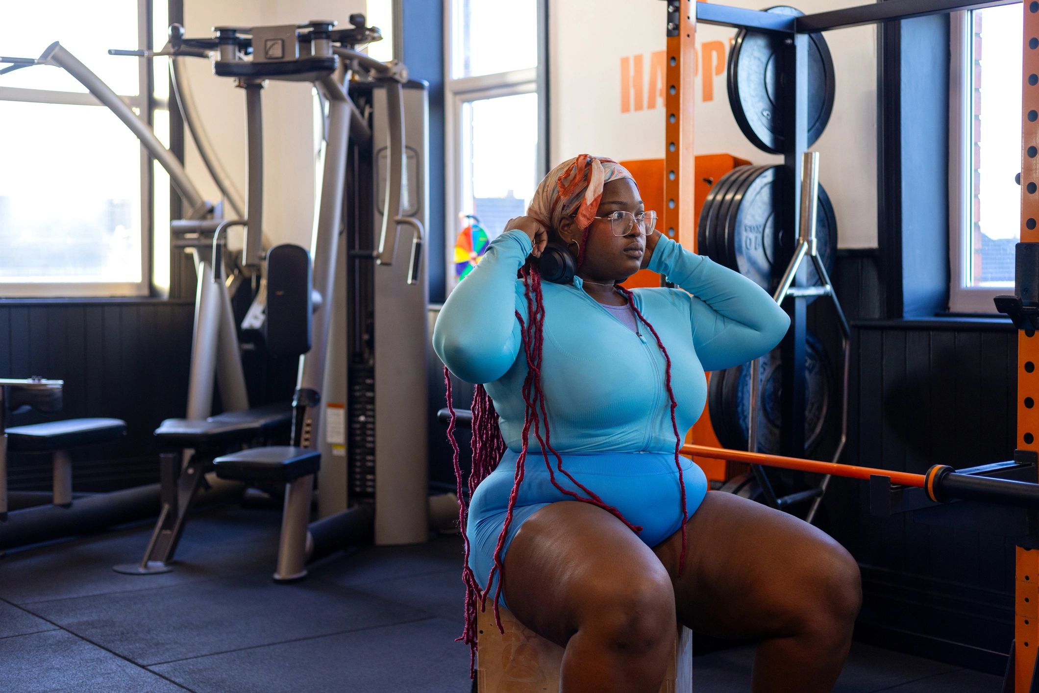 Woman strength training on a gym machine
