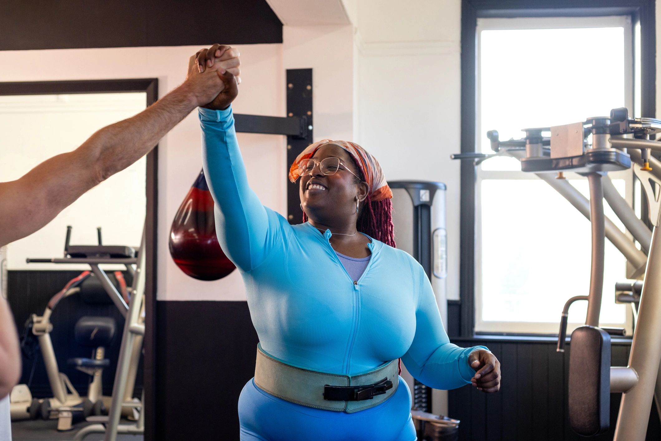 Trainer coaching a client during a workout