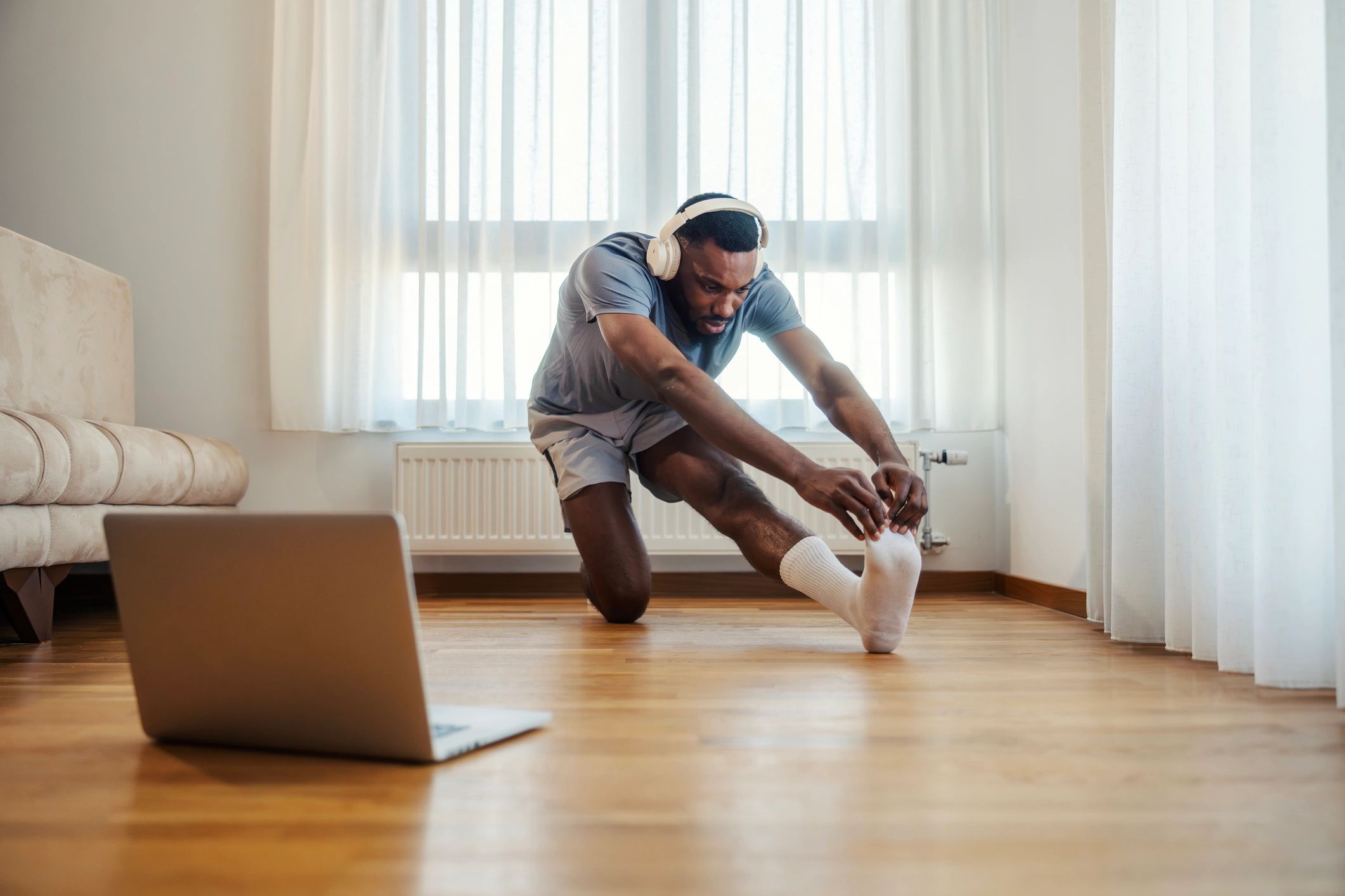 Man stretching during an at-home workout