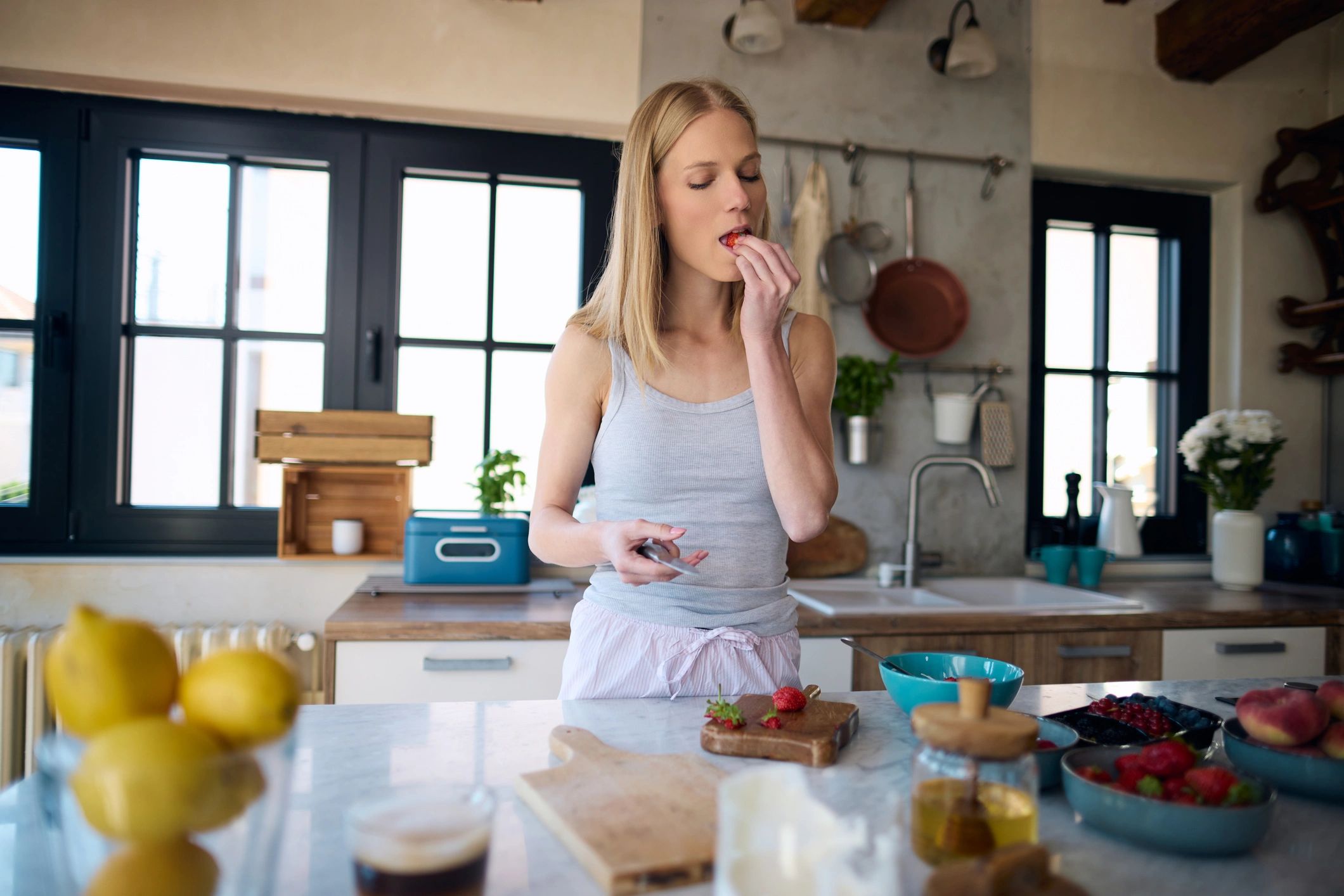 Woman preparing a healthy breakfast in a bright kitchen